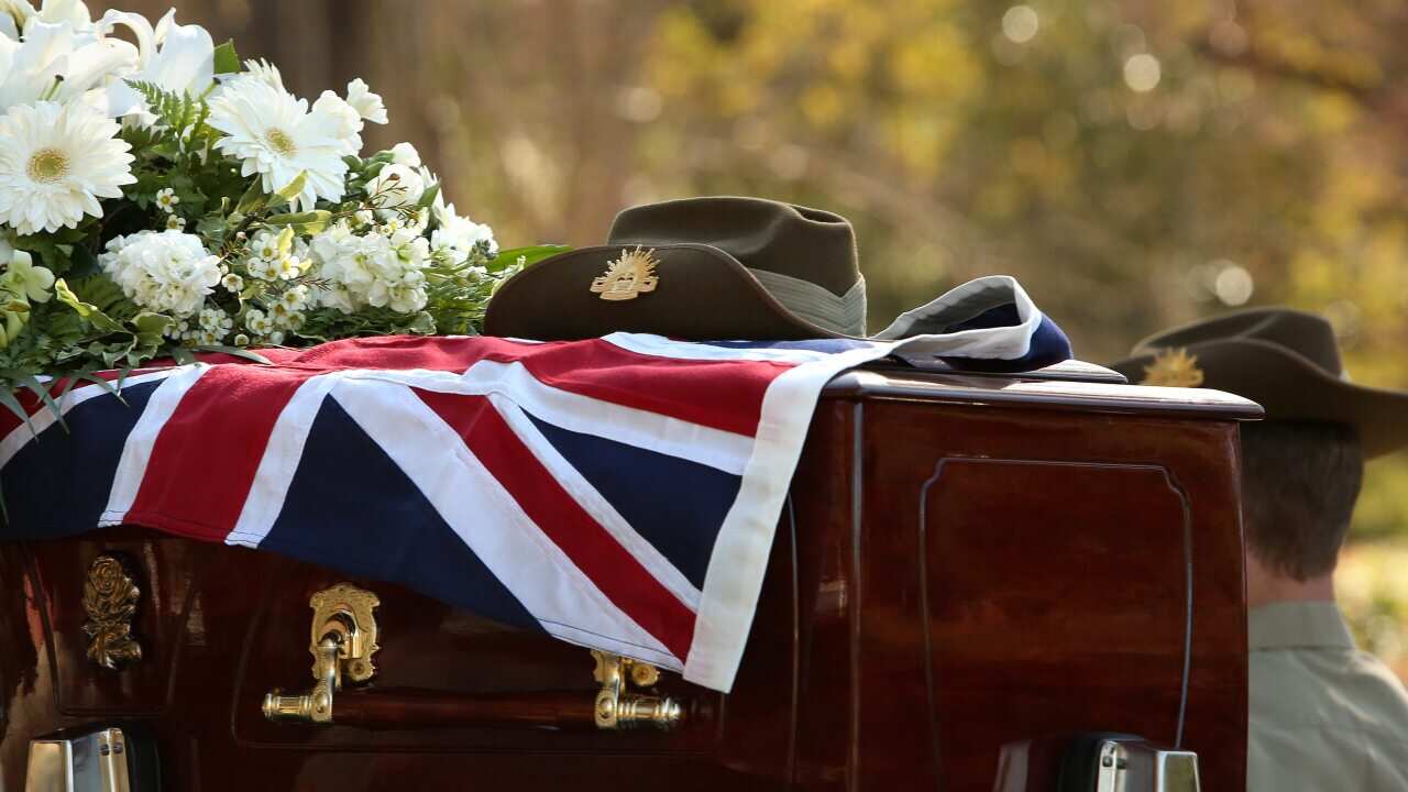 Private Robert Poate's hat sits on top of his coffin in September 2012.