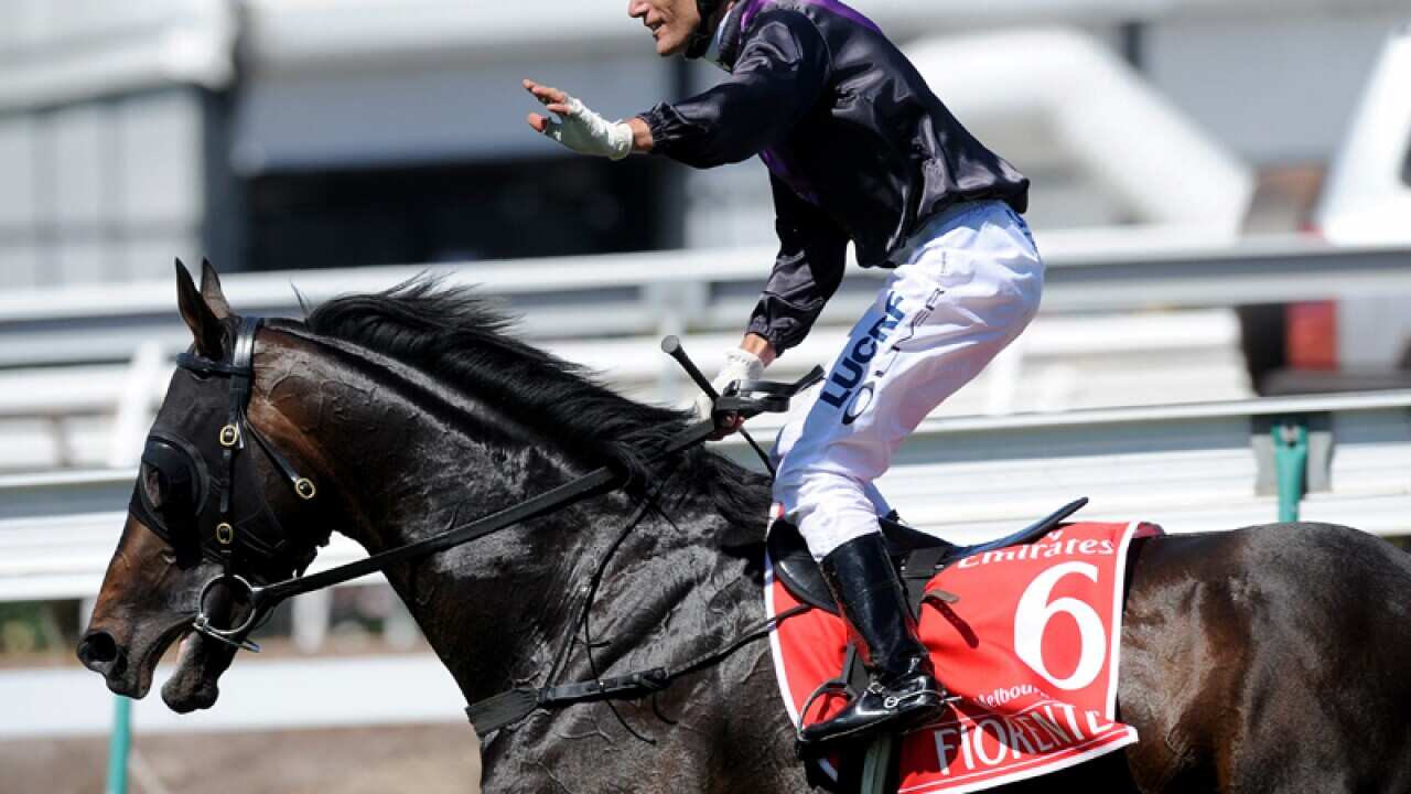 Fiorente, ridden by jockey Damien Oliver crosses the finish line