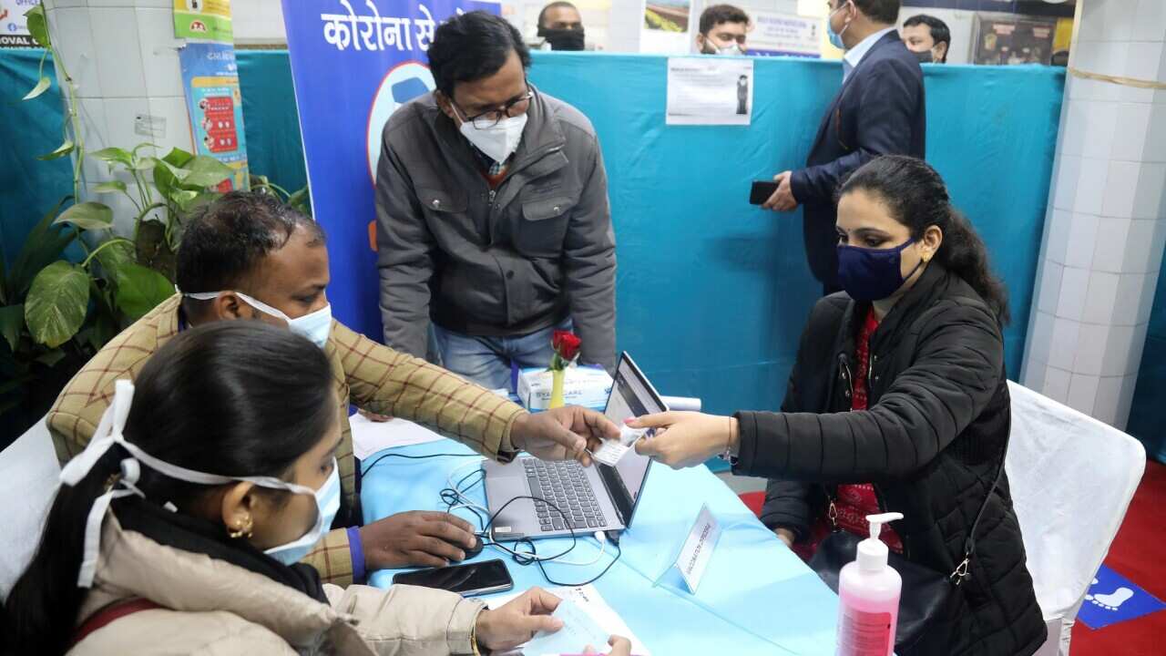 Health official and volunteers wearing face masks