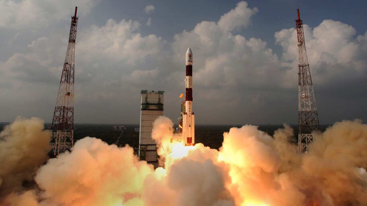 The rocket carrying the Mars Orbiter Spacecraft blasts off