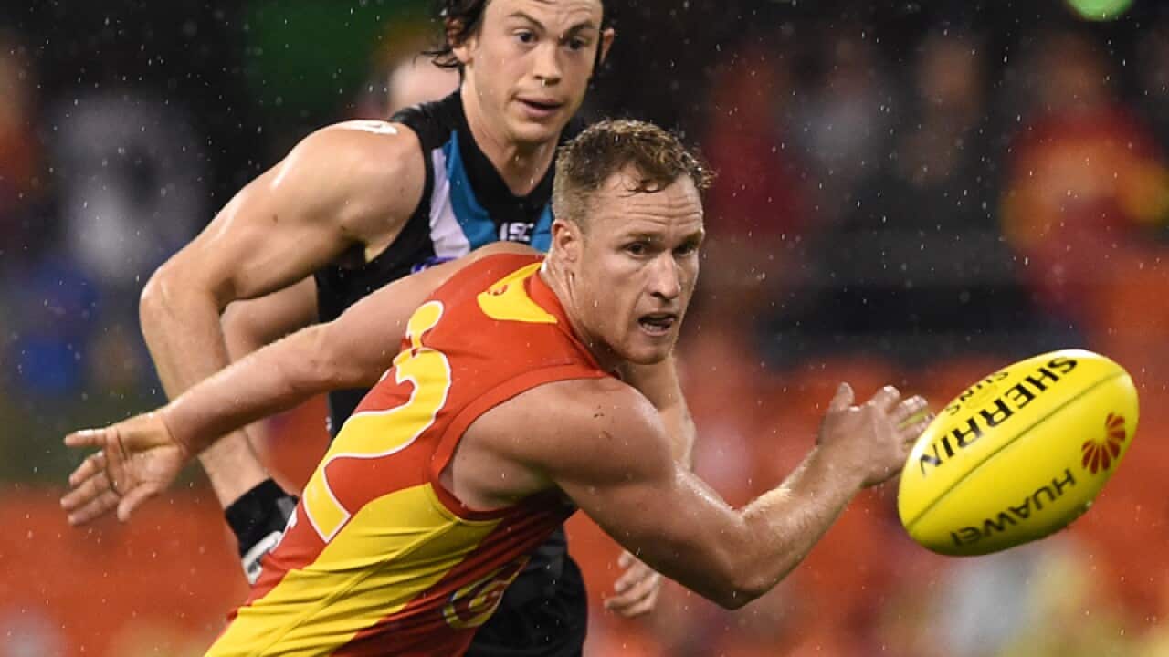 Suns player Brandon Matera looks to chase the ball