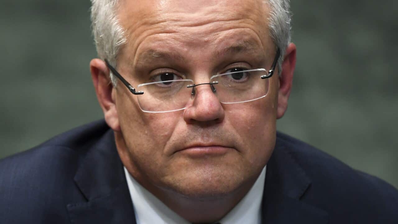 Prime Minister Scott Morrison reacts during House of Representatives Question Time at Parliament House in Canberra.