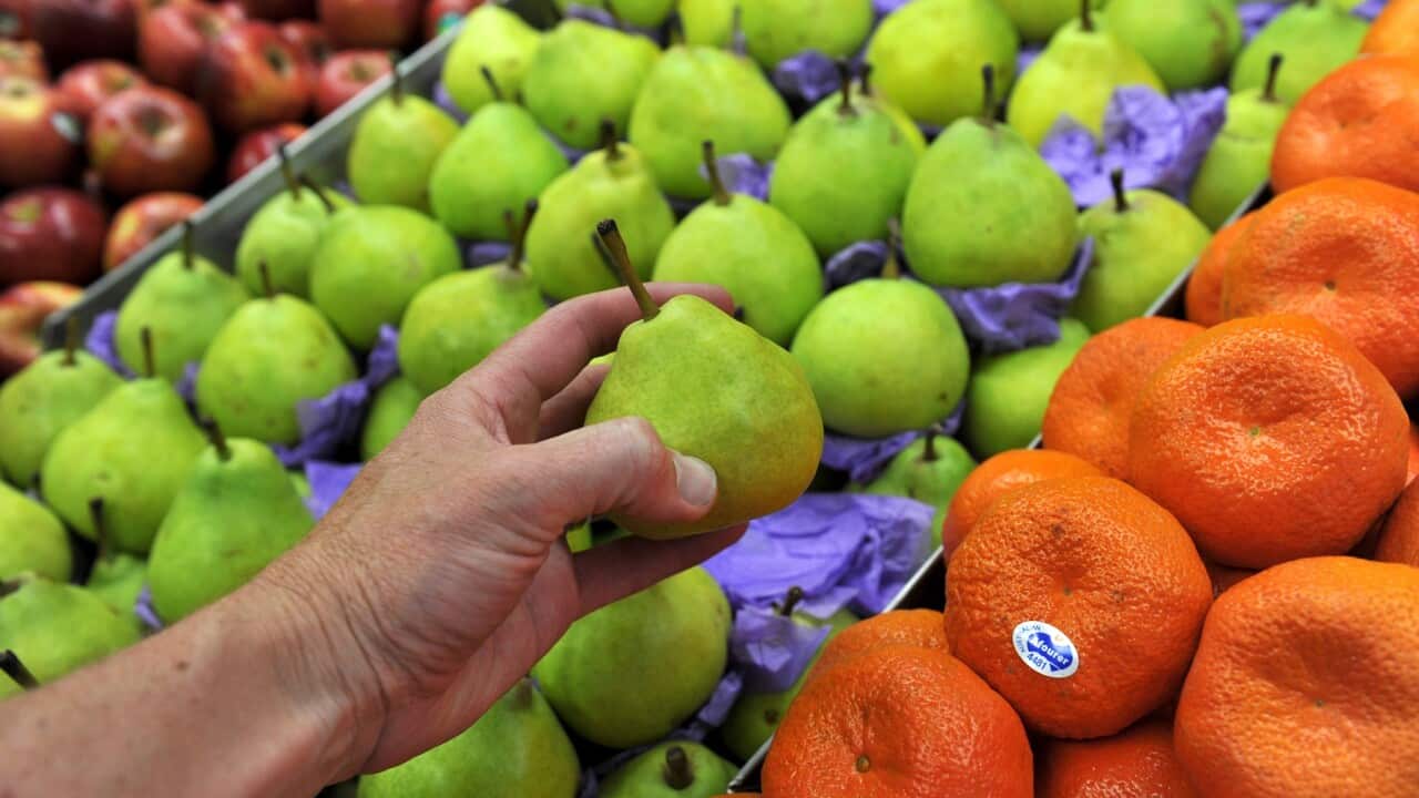 Delicious apples, pears and mandarins sit on a stall at a fruit store in Sydney (AAP)