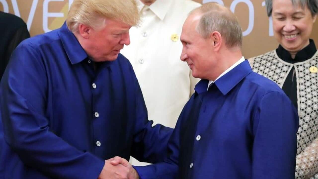 Donald Trump and Vladimir Putin shake hands at APEC.