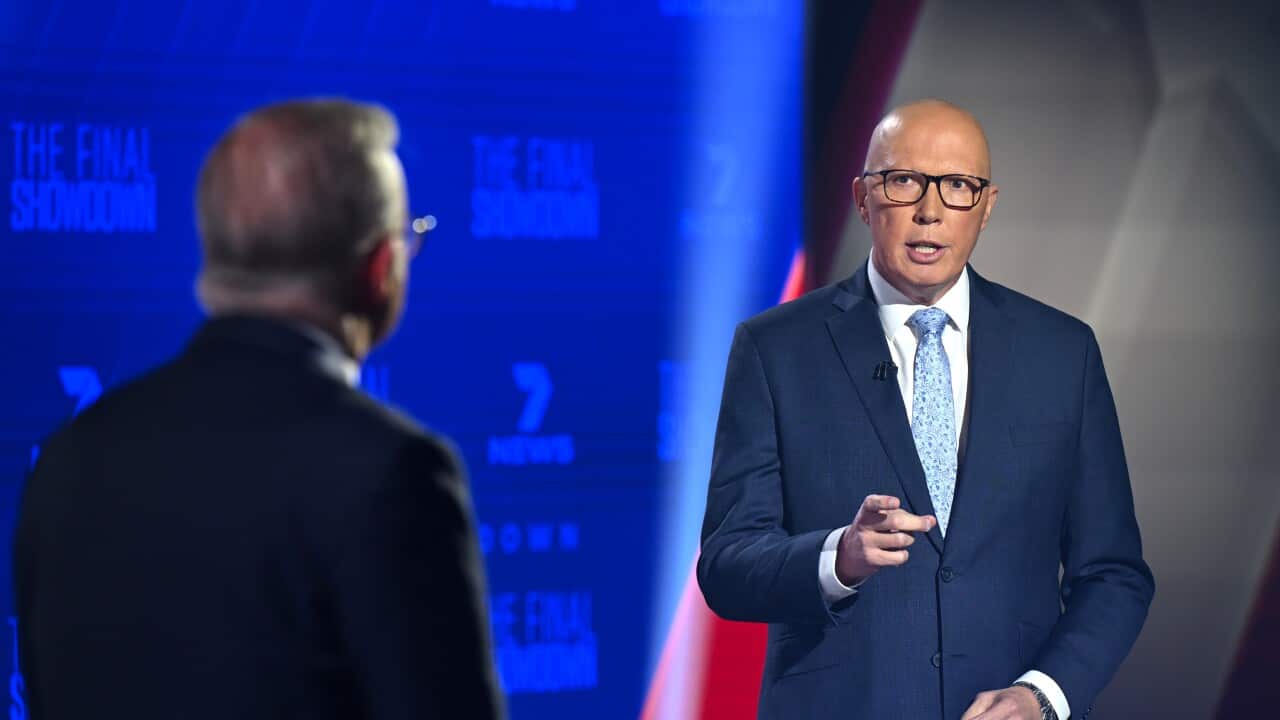 Peter Dutton gestures with his hand as he speaks