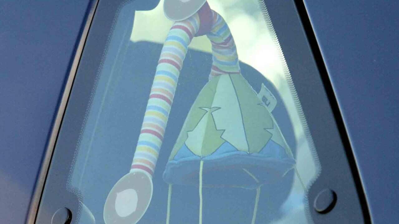 A car displays kids toys in the window