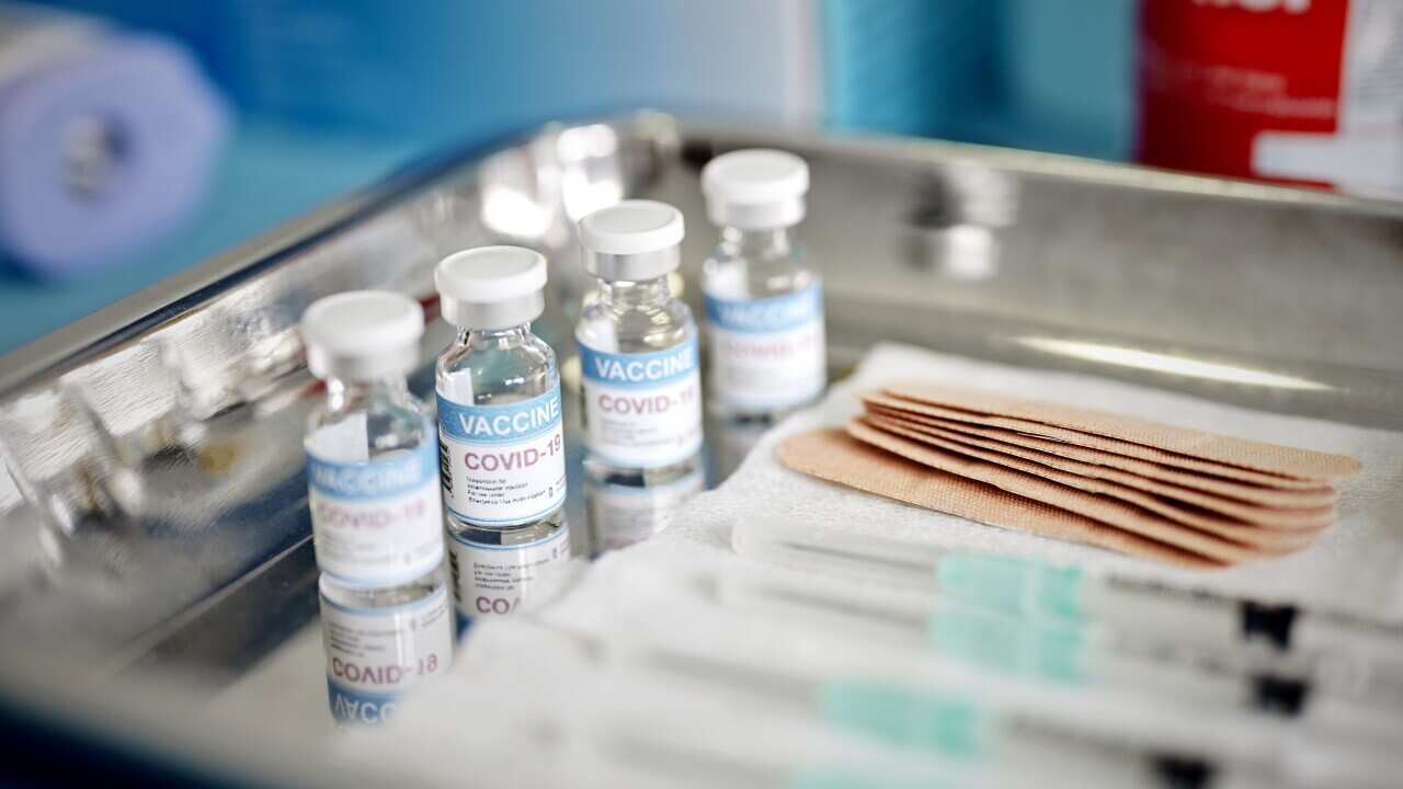 Vials With the Covid-19 Vaccine and Syringes are Displayed On a Tray at the Corona Vaccination Center.jpg