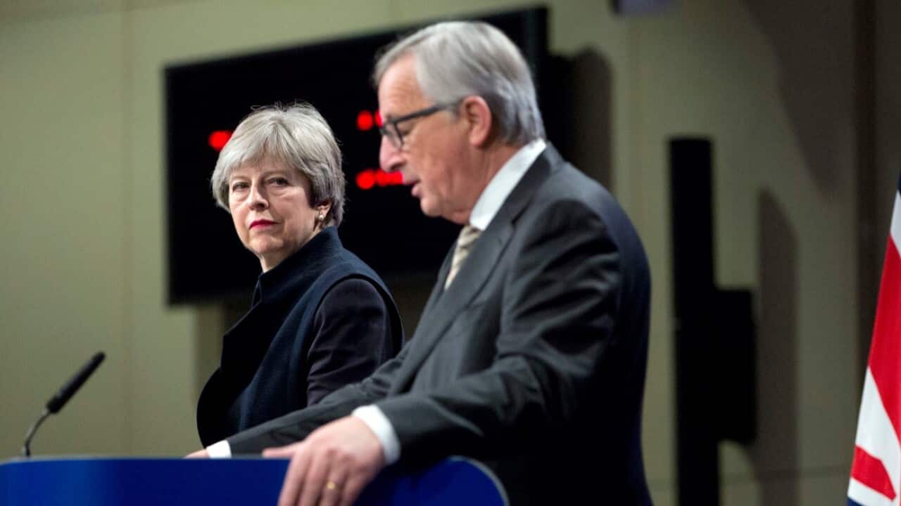  European Commission President Jean-Claude Juncker, right, and British Prime Minister Theresa May address a media conference at EU headquarters
