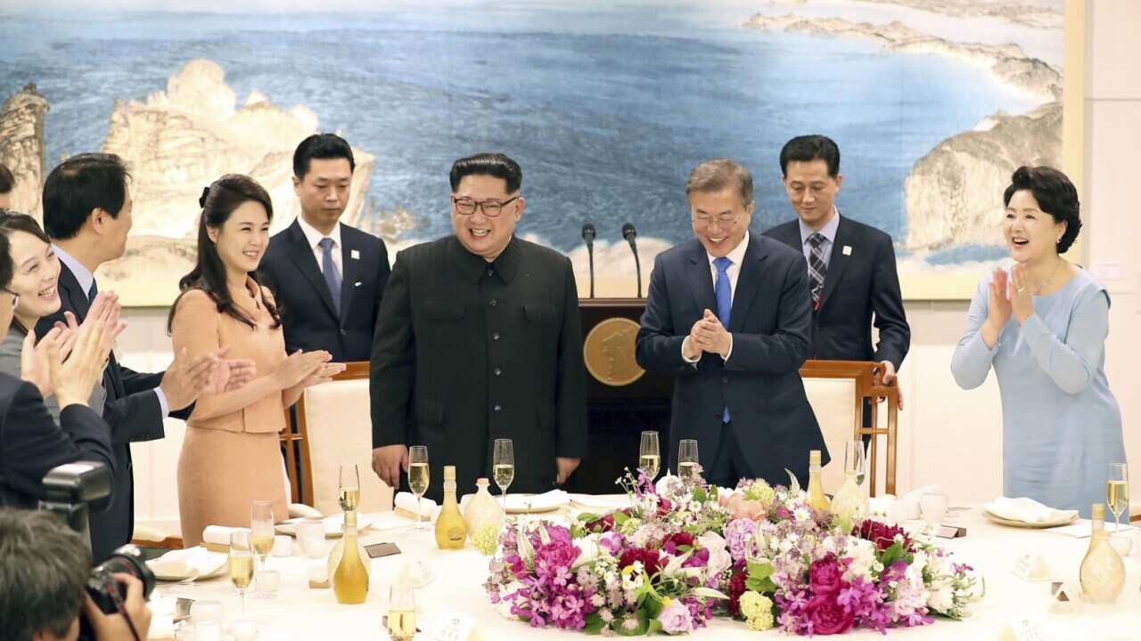 South Korean President Moon Jae In (C, R), alongside his wife Kim Jung Sook (R), and North Korean leader Kim Jong Un (C, L), alongside his wife Ri Sol Ju