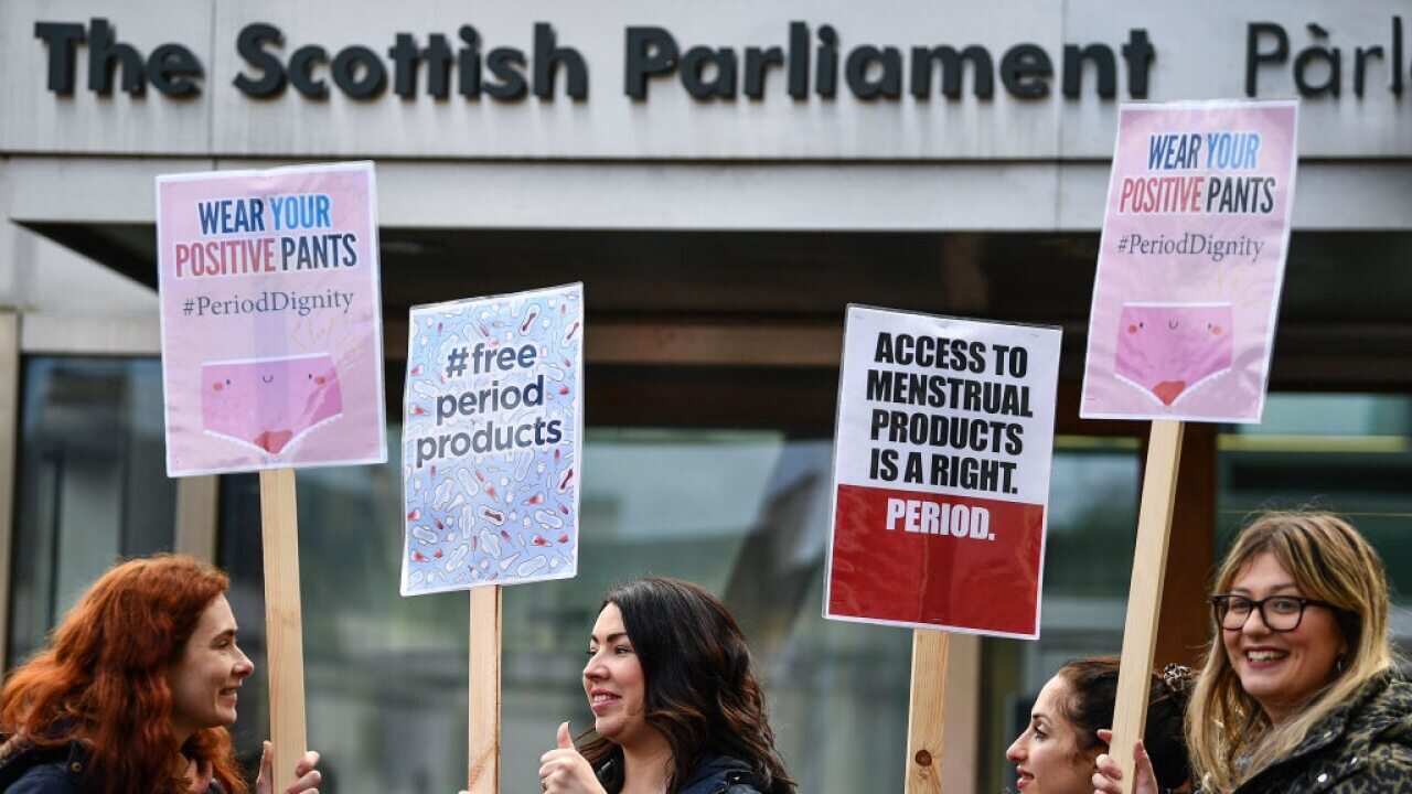 Campaigners and activists during a rally outside the Scottish Parliament in support of the Scottish Governments Support For Period Products Bill.