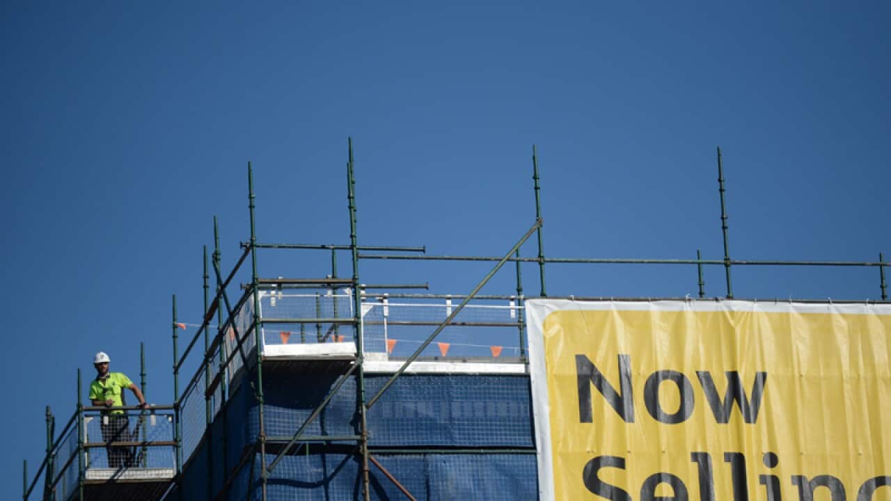 A worker is seen on a construction site