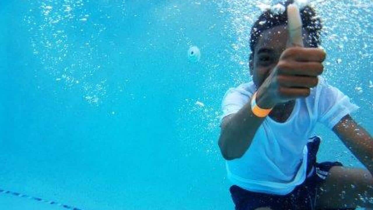 A child in a swimming pool
