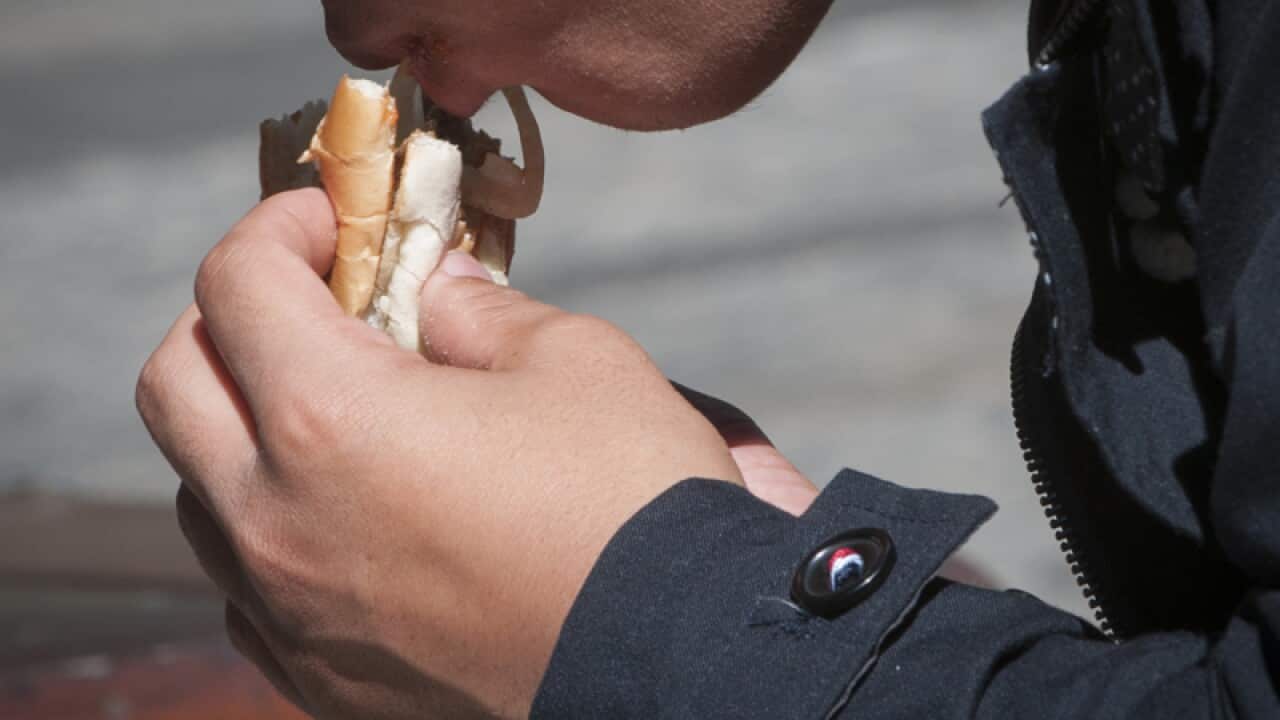 A man eats a fast food burger