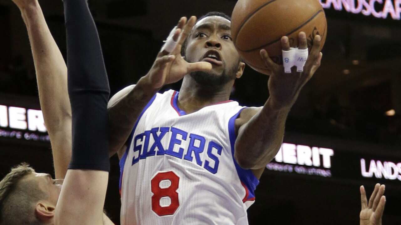 Philadelphia 76ers' Tony Wroten, center, goes up for a shot