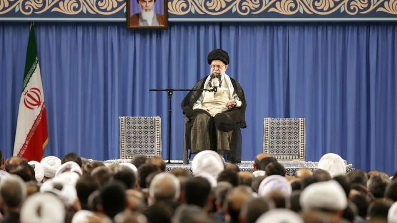 Iranian supreme leader Ayatollah Ali Khamenei (C)