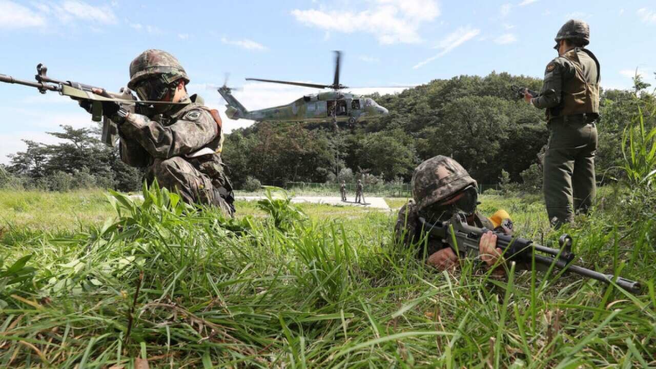 South Korean army soldiers aim their machine guns during the annual Ulchi Freedom Guardian exercise in Yongin, South Korea 