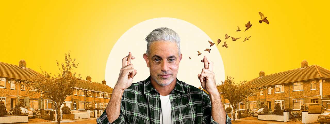 A composite image shows a man in a check shirt holding both hands up with crossed fingers. His image, which is in normal colours, is superimposed on a street scape in yellowing tones.