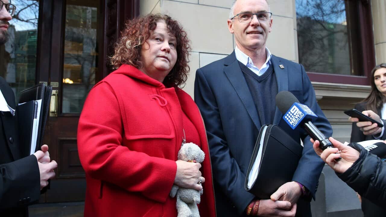 Robyn (clutching a teddy that belonged to Patrick as a child) and Matt Cronin leave the Victorian Supreme Court in Melbourne.