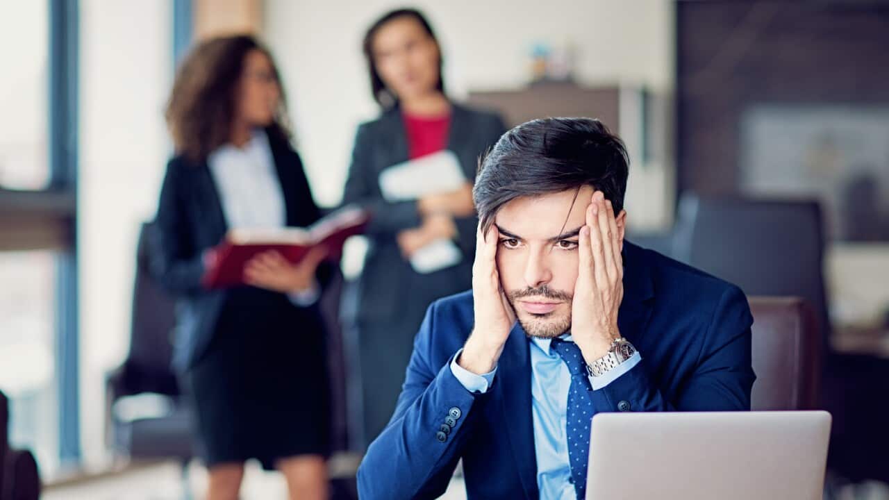 Burnout businessman under pressure in the office