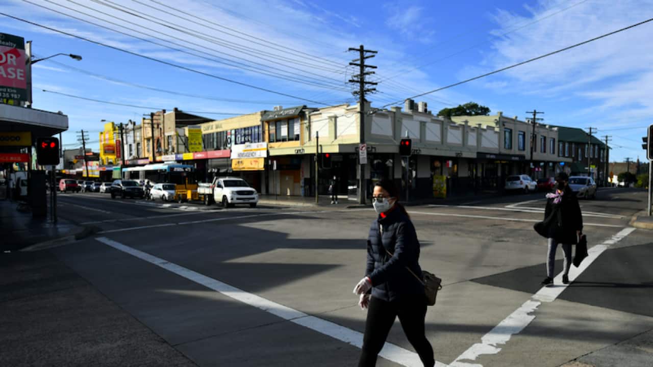 Pedestrians wearing face masks on Beamish Street at Campsie in Sydney