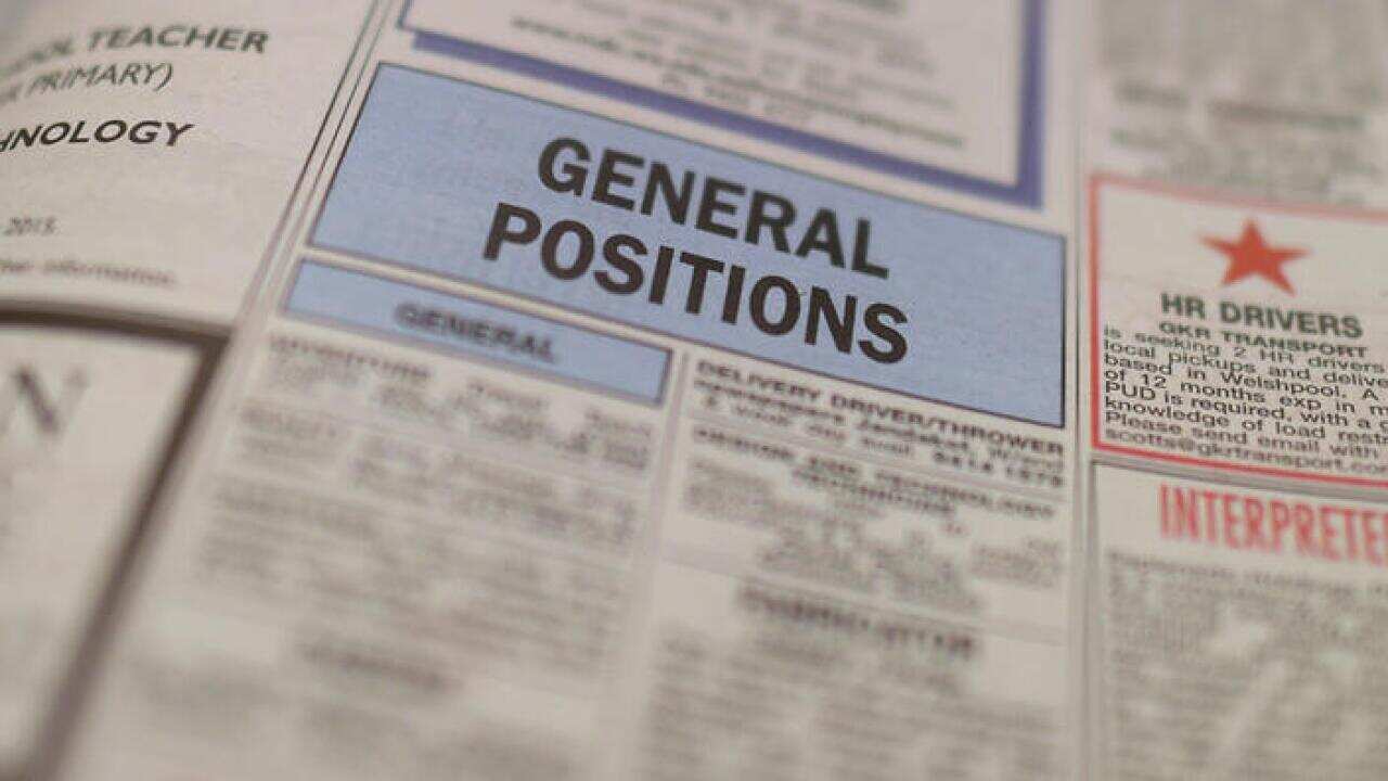 Job adverts are seen in a weekend newpaper in Canberra, Wednesday, Nov. 11, 2015. (AAP Image/Lukas Coch) NO ARCHIVING