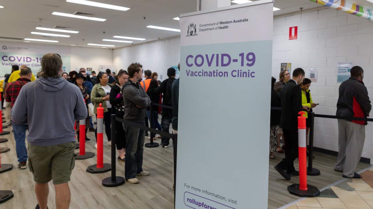 Members of the public wait to be vaccinated at a COVID-19 mass vaccination clinic in Midland, an eastern suburb of Perth.