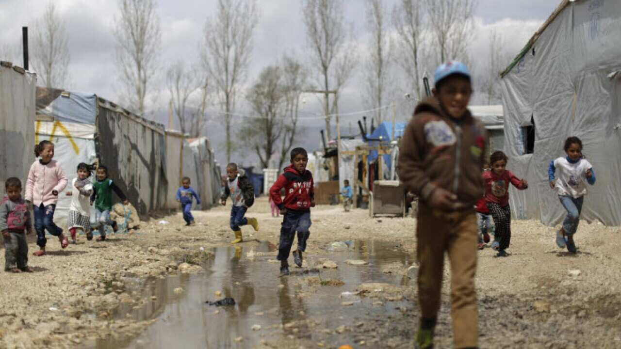 Syrian refugee children run at an informal refugee camp, at Al-Marj town in Bekaa valley, east Lebanon Lebanon