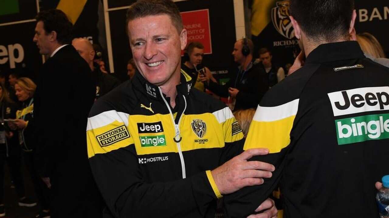 Coach of the Tigers Damien Hardwick (left)