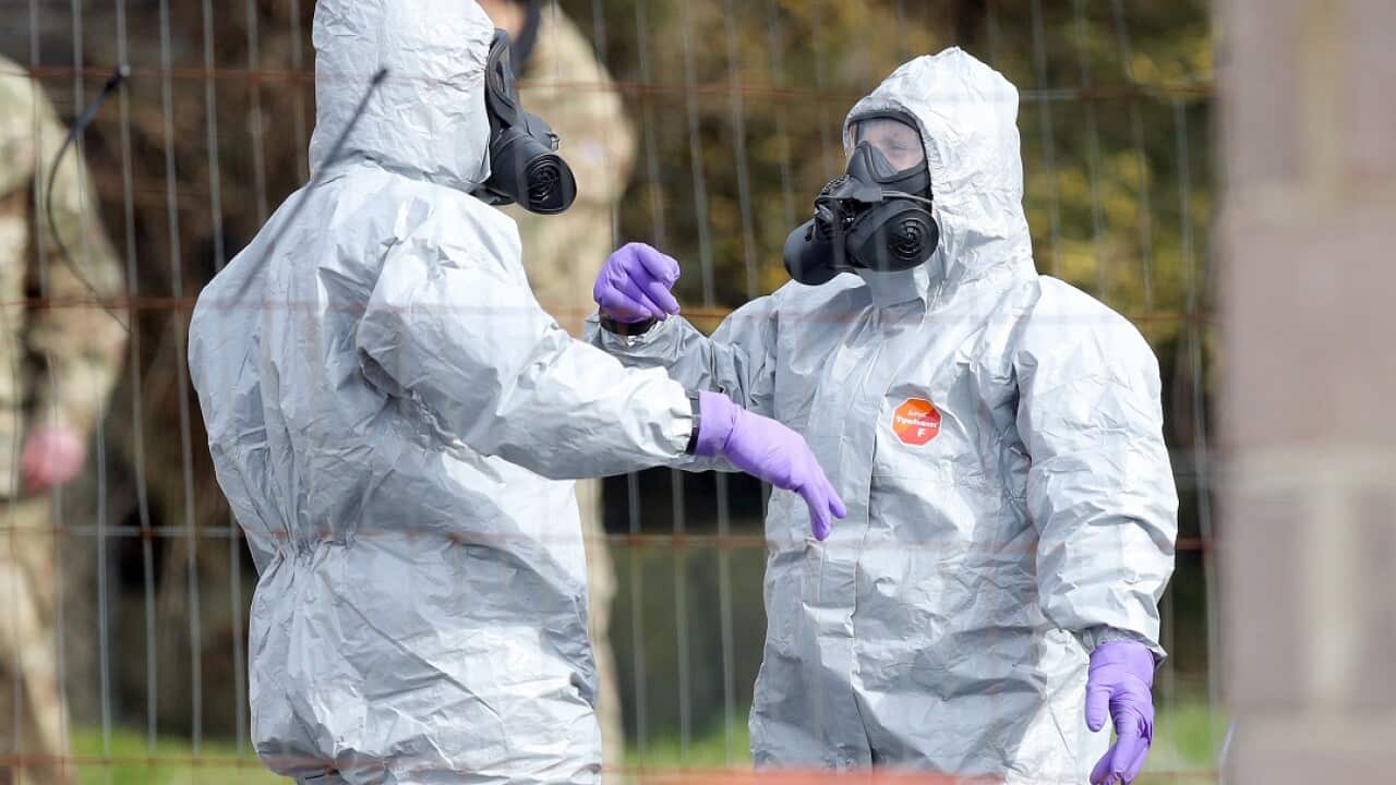 Soldiers wear protective clothing while investigating the attack on Sergei Skripal and his daughter.