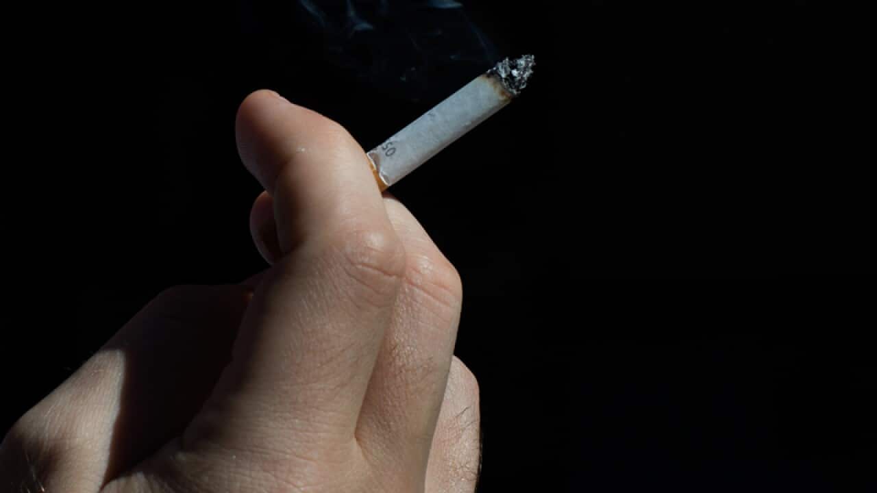 A smoker enjoys a cigarette in Sydney