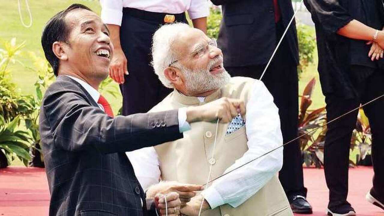 President Joko Widodo and Prime Minister Narendra Modi fly kites after launching the kite exhibition at the National Monument in Jakarta – AFP 31 May 2018.