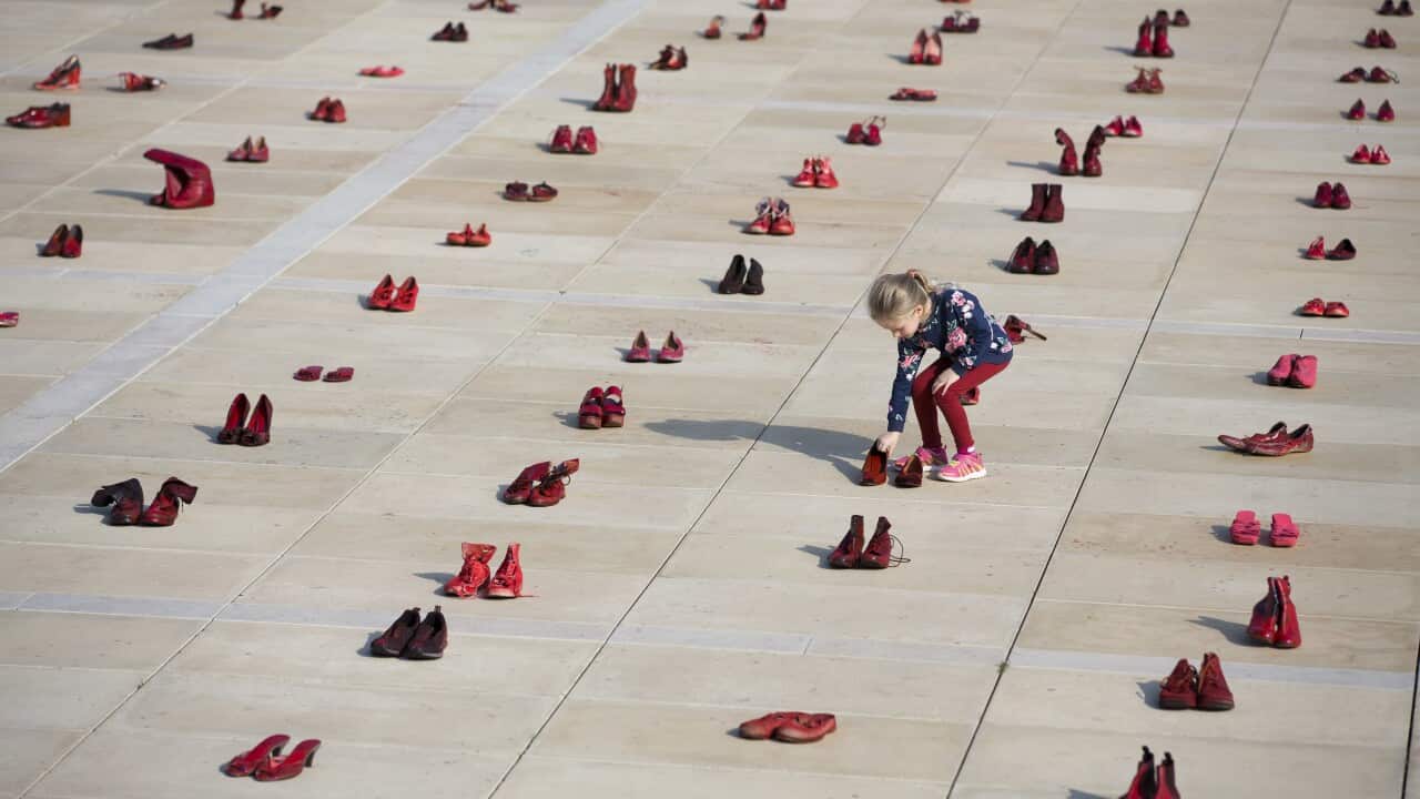 A display of hundreds of red shoes spread as protest against violence toward women in Israel at Habima Square in Tel Aviv, Israel