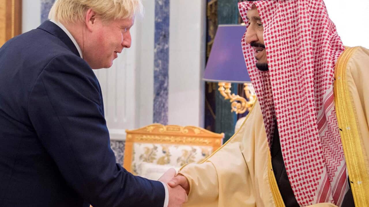 Salman Bin Abdulaziz Al-Saud (R) and Boris Johnson (L)