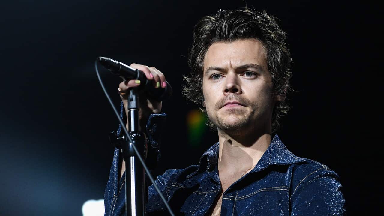 A man singing on a stage