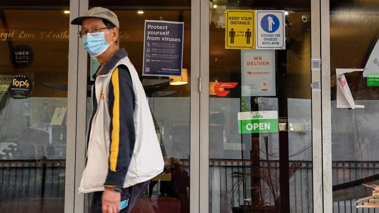 COVID-19 safety signs are placed on a restaurant door in Merrylands, Sydney, Wednesday, August 25, 2021. 