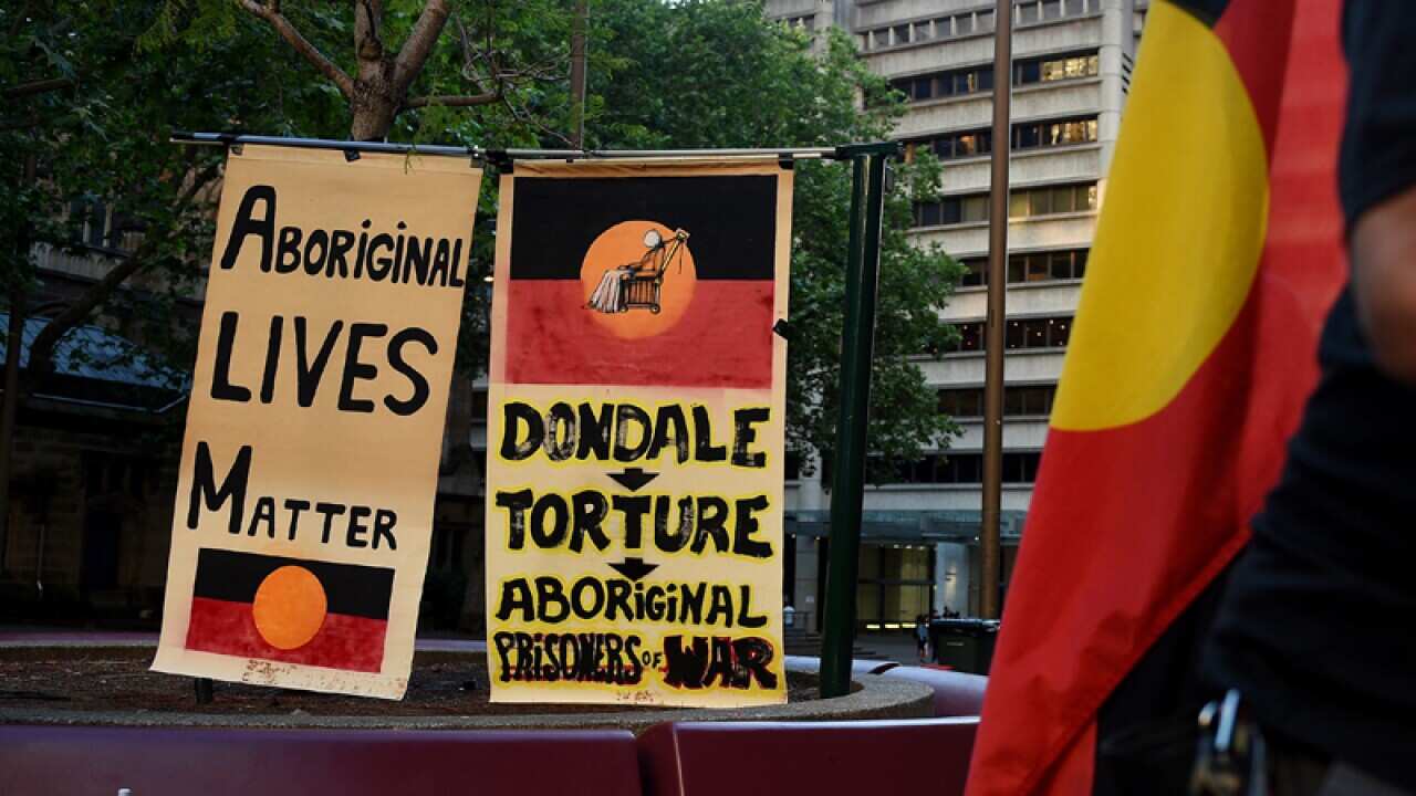 People attend a Rally for Justice at Town Hall