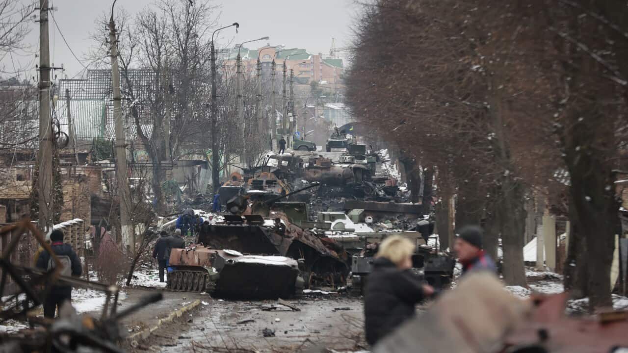 Russian military vehicles on a road in the town of Bucha, close to the capital Kyiv, Ukraine,