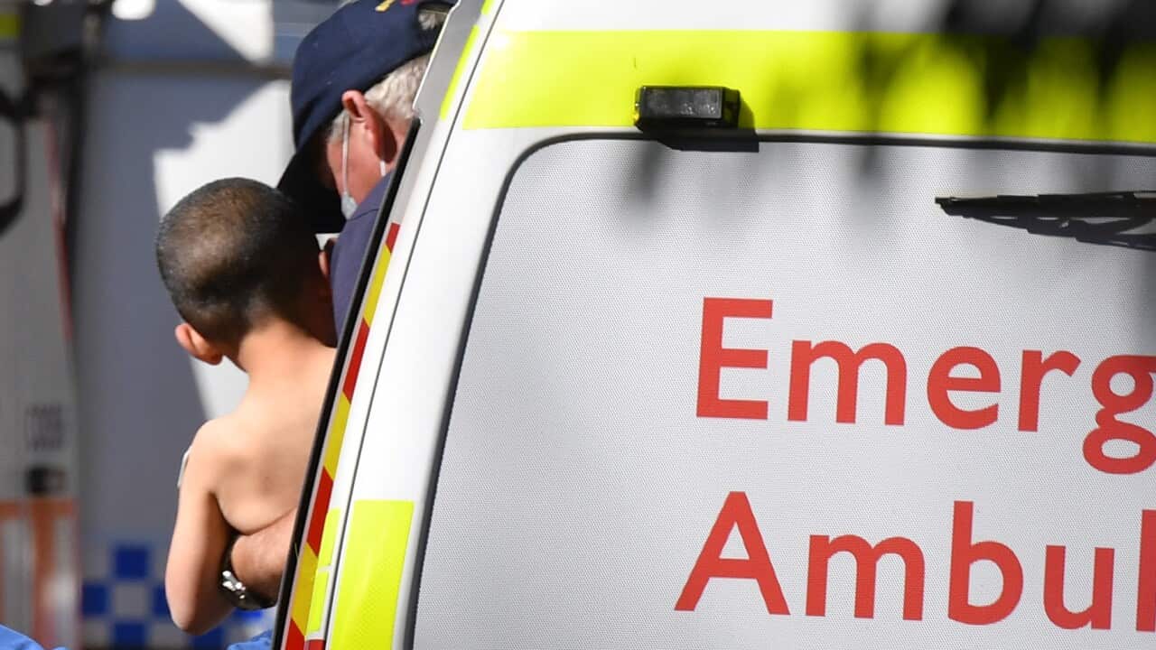 Missing three-year-old Anthony AJ Alfalak is carried from an ambulance before being transported to hospital he was found on a riverbank near Putty in the NSW Hunter region.