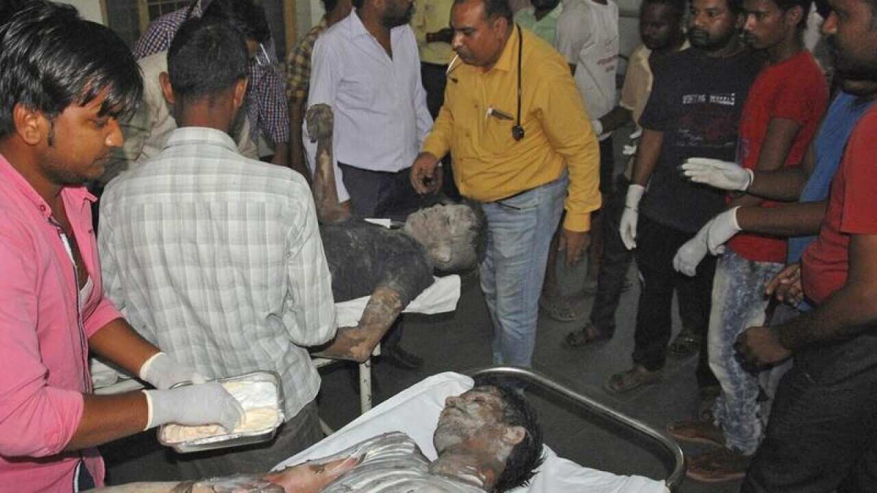 Injured people are treated at a hospital after an explosion in India