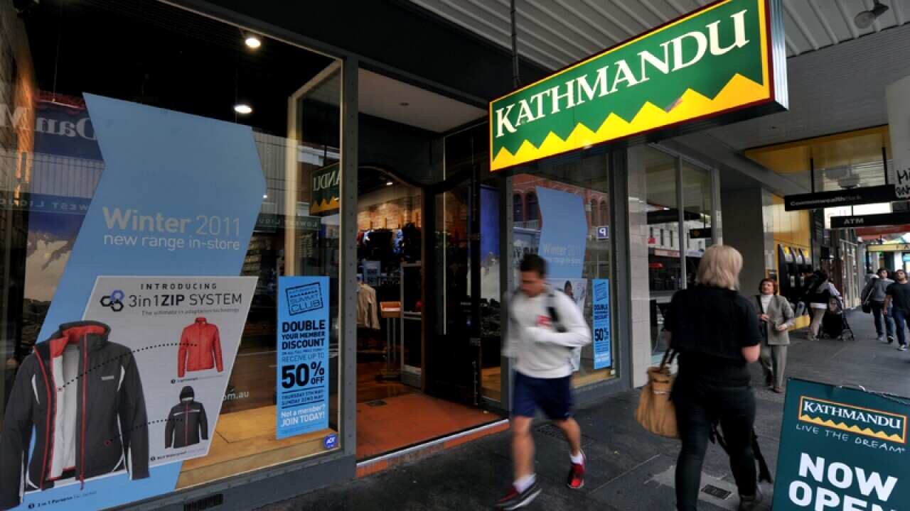 Pedestrians walk by a Kathmandu shop in Prahran