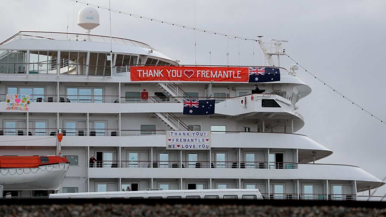 Banners are hung from the cruise ship MV Artania in Fremantle harbour in Fremantle, Saturday, 28 March, 2020.