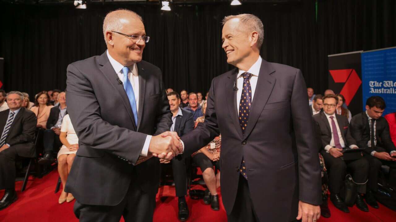 Prime Minister Scott Morrison and Opposition leader Bill Shorten shake hands before the leaders debate.