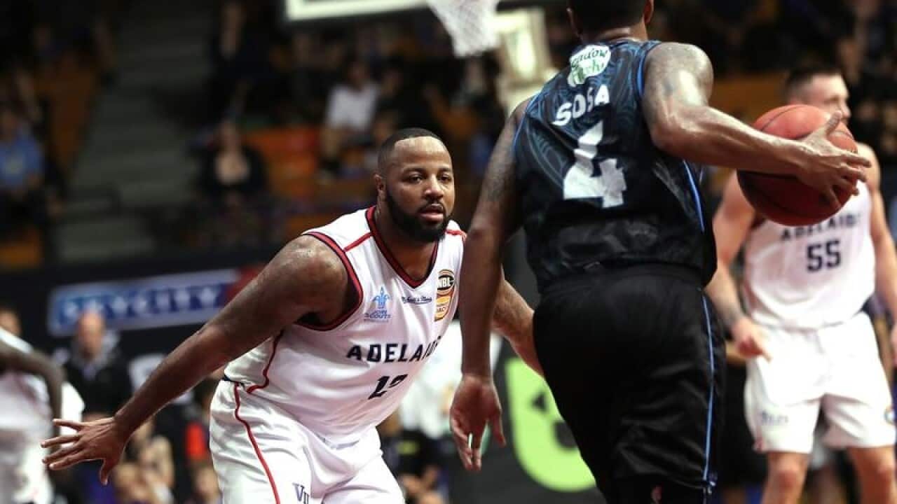 Shannon Shorter of the 36ers challenges Edgar Sosa of the Breakers.
