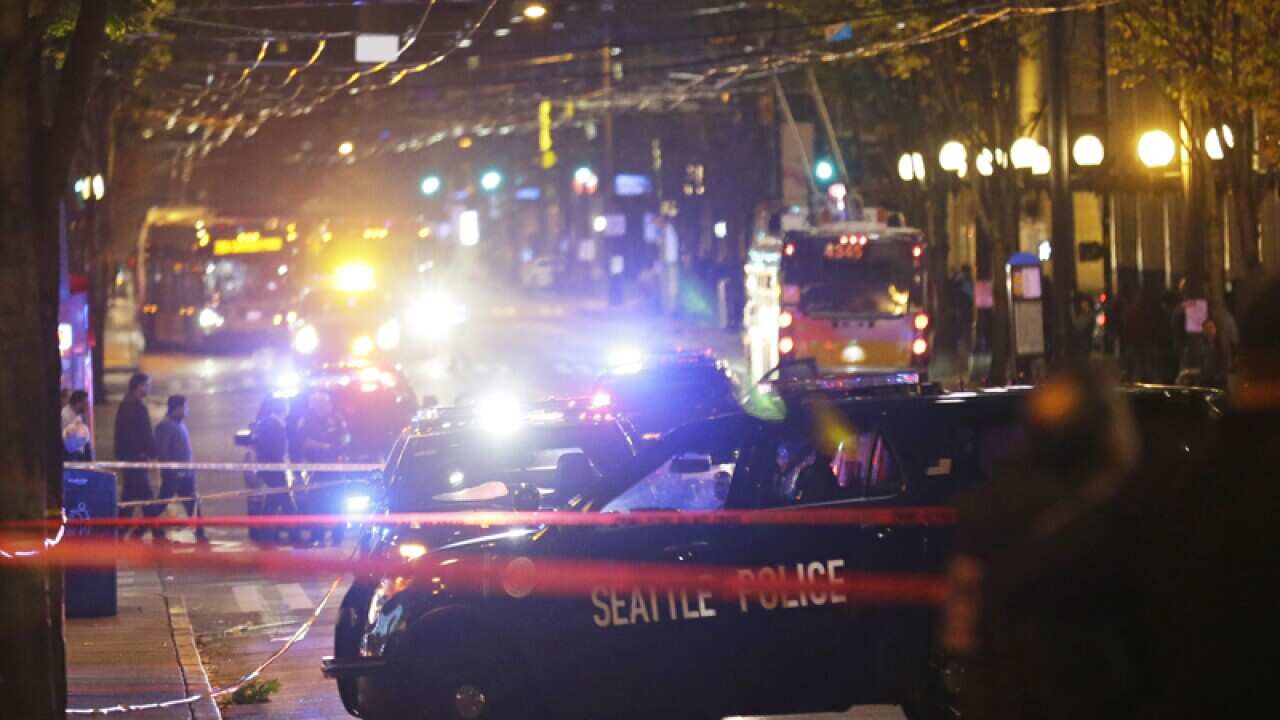 Police cars are staged at the scene