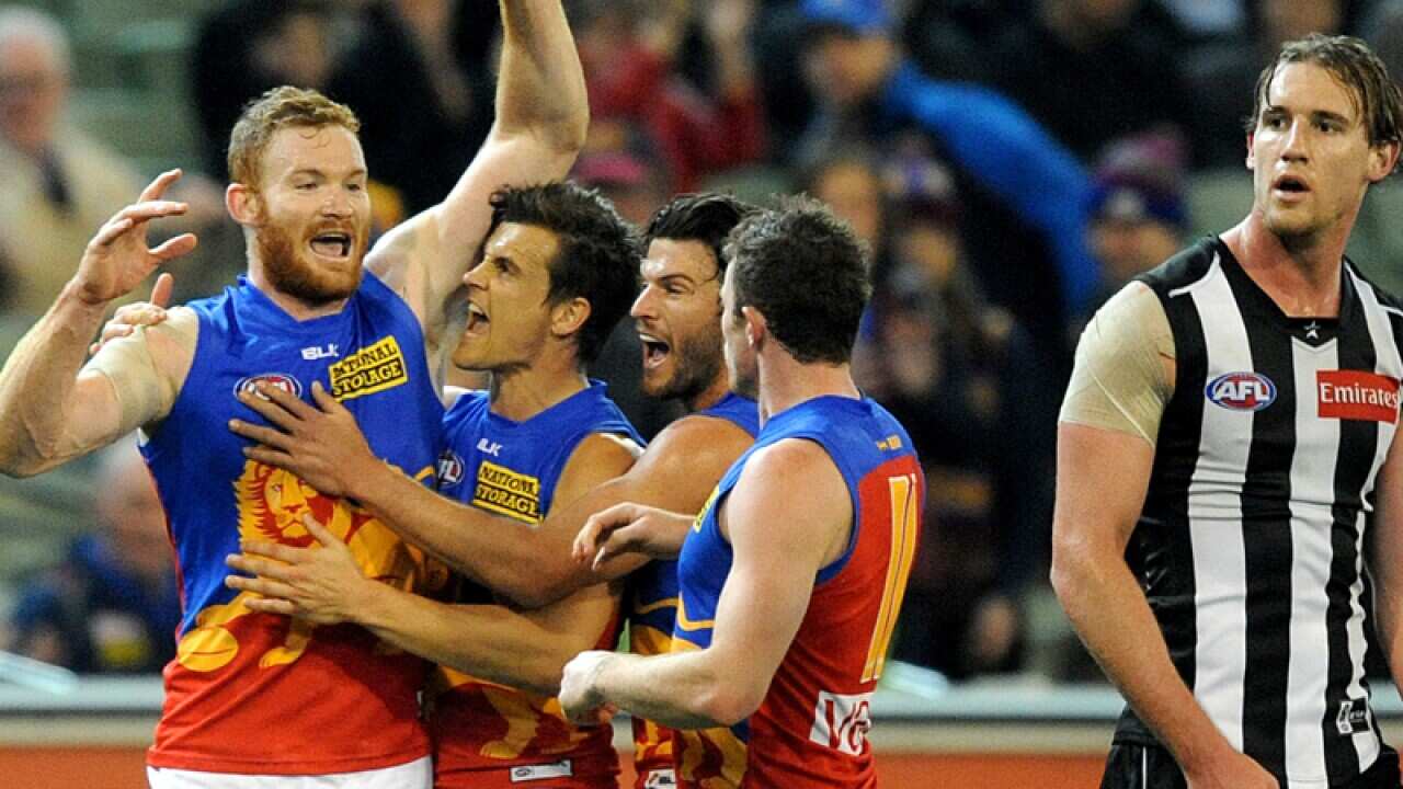 Brisbane celebrate after beating Collingwood