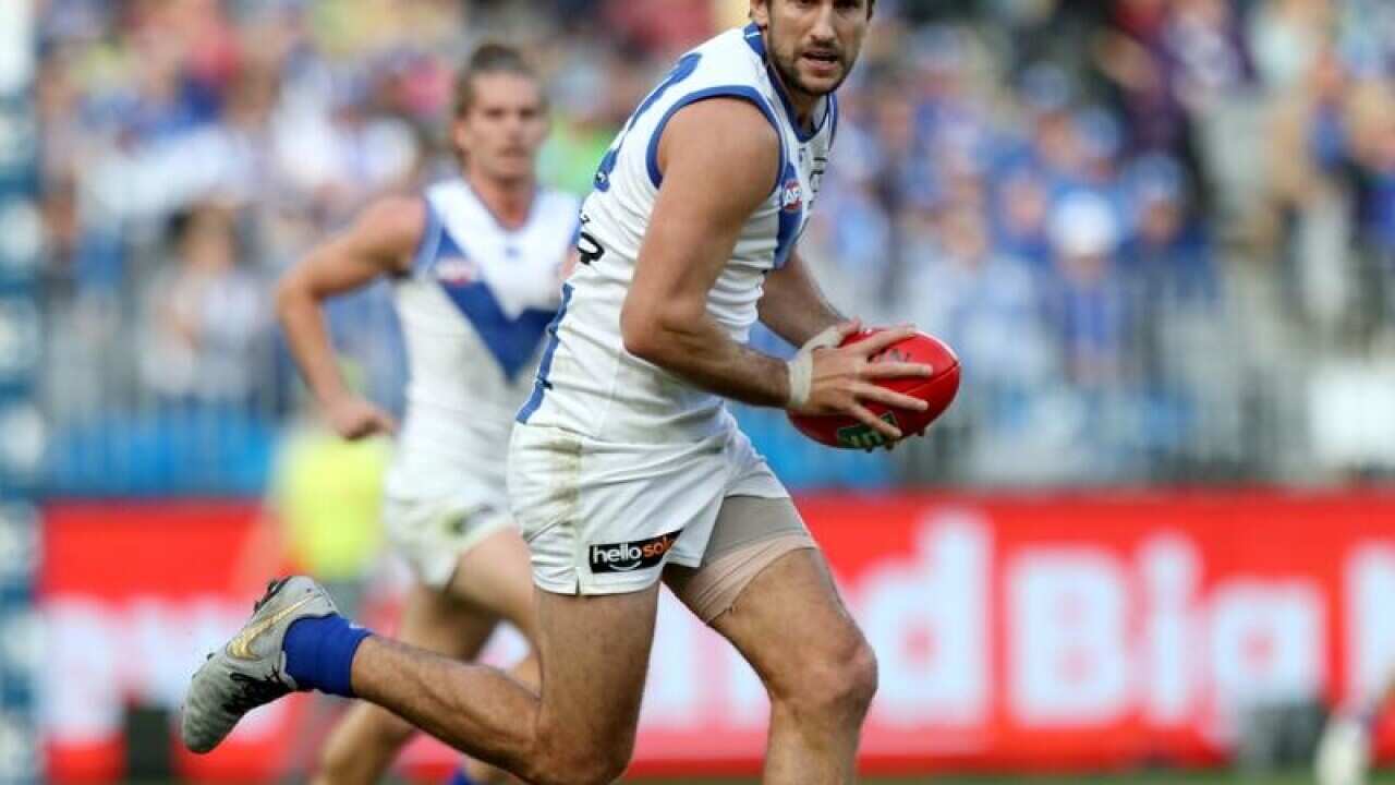 Jarrad Waite of the Kangaroos runs the ball.