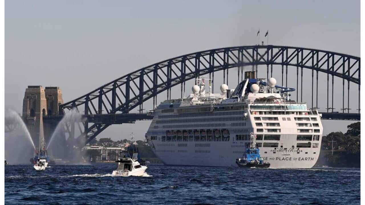 Tug boats with water cannons form a guard of honour and escort the P&O Cruises Australia flagship Pacific Explorer is it enters Sydney Harbour.