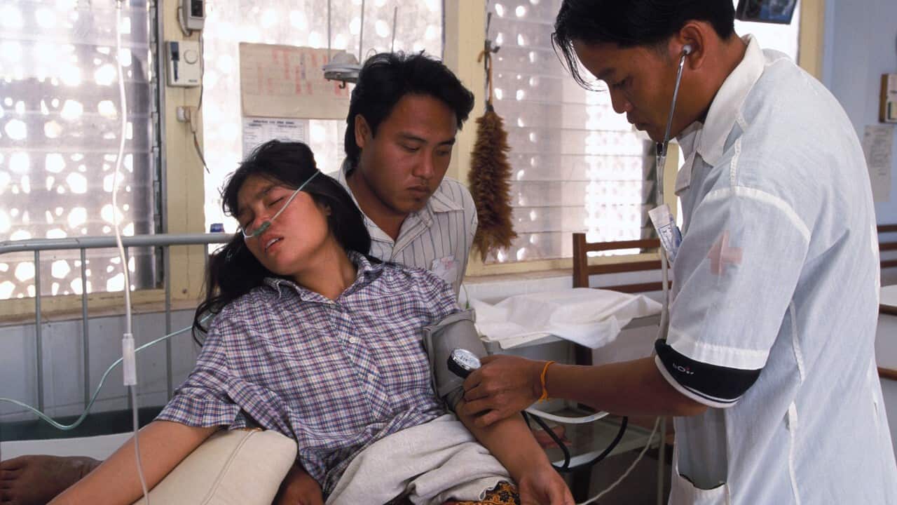 Taking Patient's Blood Pressure During Consultation In Laos ( BSIP-UIG Via Getty)