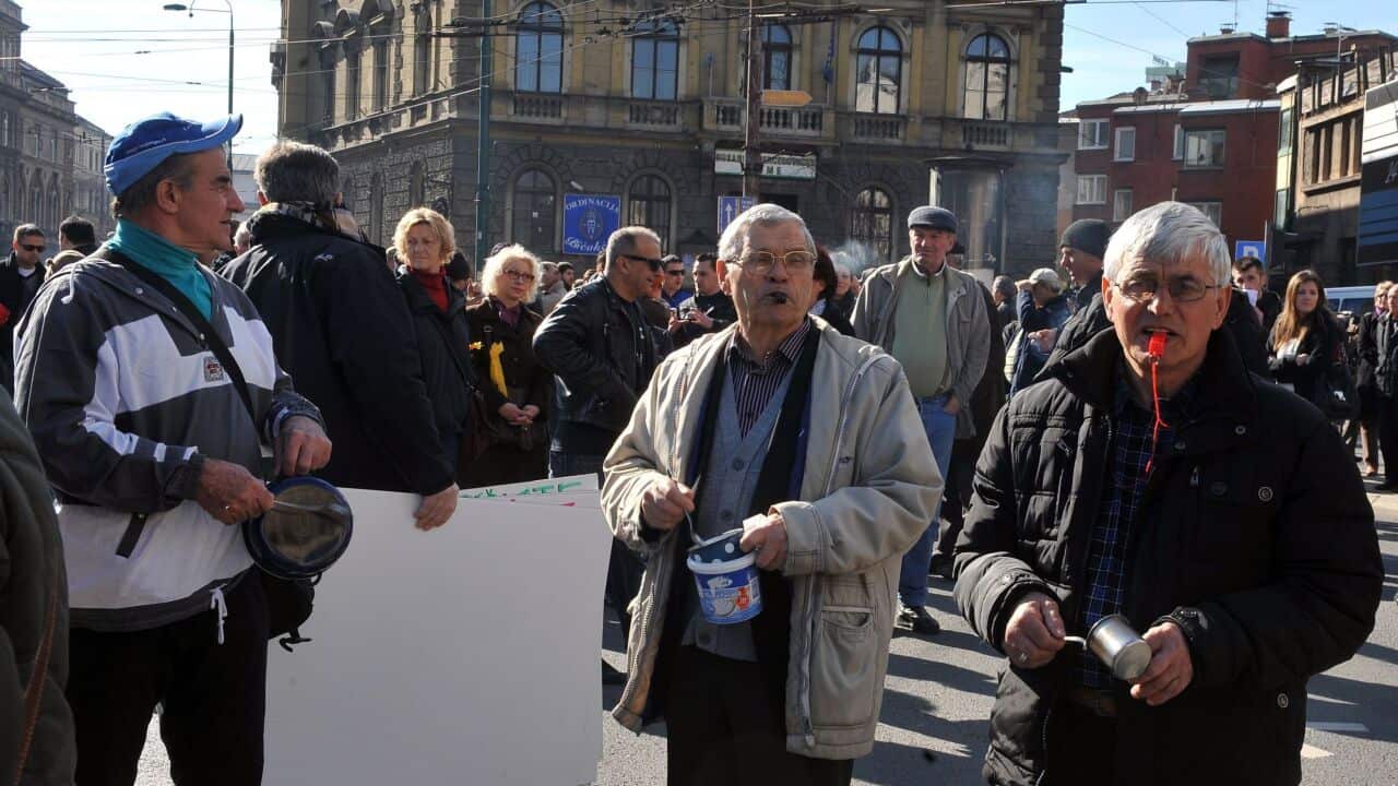 Bosnian protestors use whistles and pots to make noise during a demonstration in Sarajevo, on February 15 - AAP-1.jpg