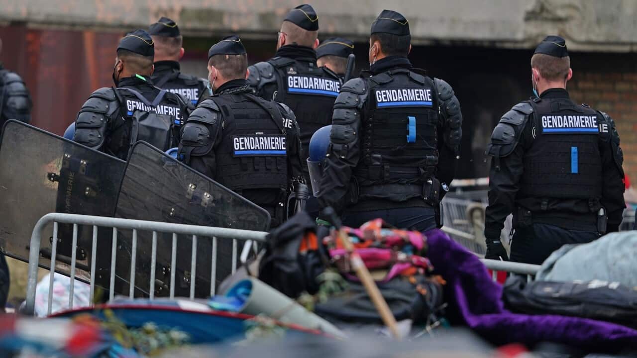 French police evacuate a makeshift migrant camp in Dunkirk, Northern France